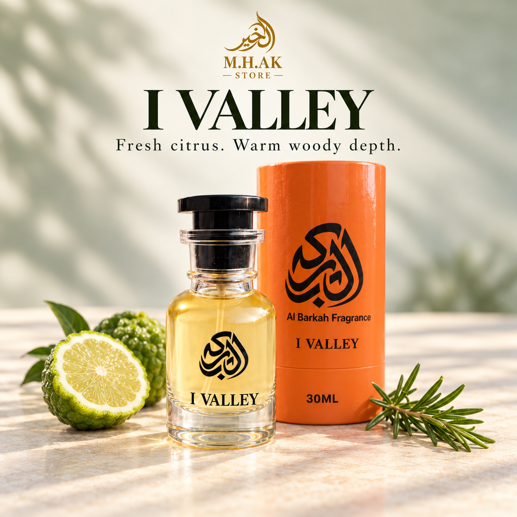 Al Barkah I Valley 30ml perfume bottle beside its orange cylindrical packaging