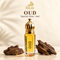 Oud 6ml attar with gold cap and oud wood pieces, with the MHAK Store logo